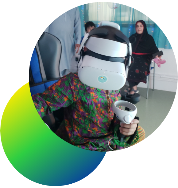 A child wearing a green dress using a VR headset